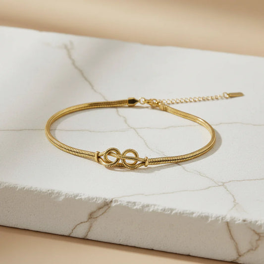 Gold Bow Jewellery Combo Set for Women – Pearl Bow Earrings, Bow Pendant Necklace & Infinity Bracelet LCS10120